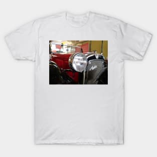 Head light of a vintage red car with background blur T-Shirt